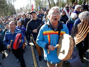 (FILES) In this file photo taken on March 10, 2018, Indigenous leaders, Coast Salish Water Protectors and others demonstrate against the expansion of Texas-based Kinder Morgans Trans Mountain pipeline project in Burnaby, British Columbia, Canada.