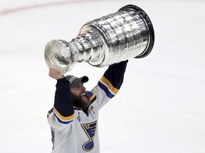 CP-Web. St. Louis Blues' Alex Pietrangelo carries the Stanley Cup after the Blues defeated the Boston Bruins in Game 7 of the NHL Stanley Cup Final, Wednesday, June 12, 2019, in Boston.
