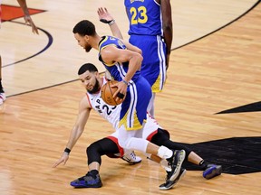 Jun 10, 2019; Toronto, Ontario, CAN; Toronto Raptors guard Fred VanVleet (23) slips while defending Golden State Warriors guard Stephen Curry (30) during the third quarter in game five of the 2019 NBA Finals at Scotiabank Arena. Mandatory Credit: Nick Turchiaro-USA TODAY Sports