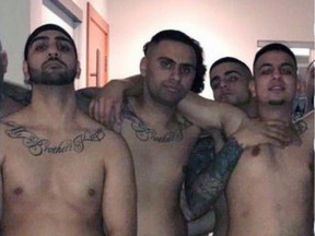 Sumdish Gill, who pleaded guilty to assault June 20, is second from the right, peaking over his friend's shoulder in undated Brothers Keepers photo