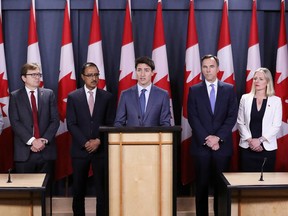 Prime Minister Justin Trudeau speaks during a news conference about the government's decision on the Trans Mountain expansion project with Transport Minister Marc Garneau, Fisheries Minister Jonathan Wilkinson, Natural Resources Minister Amarjeet Sohi, Finance Minister Bill Morneau and Environment Minister Catherine McKenna in Ottawa on June 18.