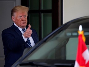 U.S. President Donald Trump gives a thumbs-up to Canada's Prime Minister Justin Trudeau (not shown), as he leaves after a meeting at the Oval Office of the White House in Washington, D.C., on Thursday, June 20, 2019.