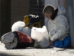 A man has a cigarette in an alleyway in Vancouver's Downtown Eastside, Wednesday, Feb. 6, 2019. Photo: Jonathan Hayward/CP