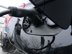 A car is charged at a charge station for electric vehicles on Parliament Hill in Ottawa earlier this month.