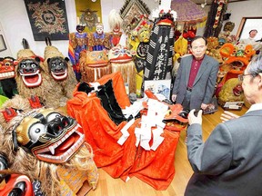 Yuichi Takahashi, right, collected various large shishi in Japan and abroad. Each has a different expression and a distinctive personality. (Photo for The Japan News by Taku Yaginuma)
