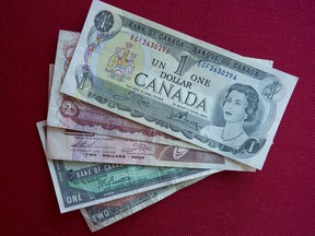 A selection of Canadian $1 and $2 bills from an earlier era. Their legal tender designation is being removed by the federal government.