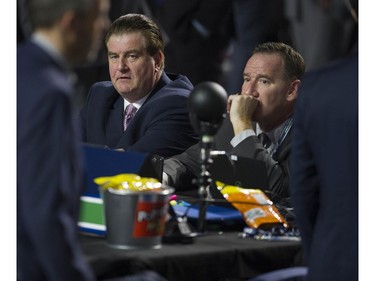 Vancouver Canucks GM Jim Benning and AGM John Weisbrod before the start of Round 1 of the 2019 NHL Draft at Rogers Arena, Friday, June 21, 2019.