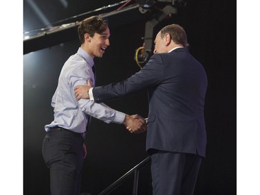 Dylan Cozens is greeted to the stage by NHL Commissioner Gary Bettman after being selected by the Buffalo Sabres in the first round of the 2019 NHL Draft at Rogers Arena.