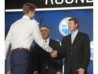 Philip Broberg is greeted to the stage by Edmonton Oilers executive Wayne Gretzky after Broberg was selected by the Oilers in the first round of the 2019 NHL Draft.