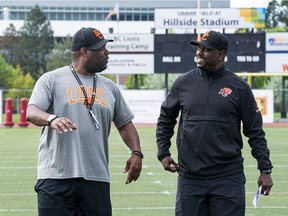 B.C. Lions general manager Ed Hervey (right) talks with head coach DeVone Claybrooks during 2019 training camp at Hillside Stadium in Kamloops on May 20.