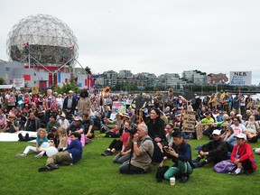 Opponents to the Trans Mountain pipeline expansion rallied in the park next to Science World on Sunday to voice their wish that the Liberal government cancel the project. Photo: Nick Procaylo