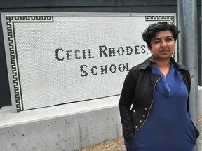 Jennifer Reddy, OneCity school trustee, stands by the Cecil Rhodes sign at the primary playground area at L'Ecole Bilingue in Vancouver earlier this month.
