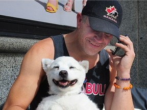 Dave M., a homeless man whose American Eskimo dog Cutiepie was stolen last month reunited with his dog on Granville St in Vancouver,  BC., June 16, 2019.