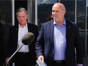 Premier John Horgan and George Heyman, Minister of Environment and Climate Change Strategy, respond to the federal government's decision on the Trans Mountain Expansion Project, in Vancouver,  BC., June 18, 2019.
