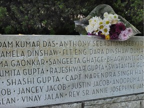 Flowers are placed on the memorial in Stanley Park to those who lost their lives on June 23, 1985, when a bomb went off on Air India flight 182. Photo: Nick Procaylo/PostMedia