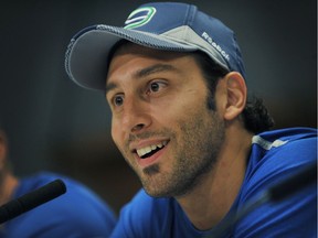 Roberto Luongo talks to the media at a press conference in Vancouver in September 2013.