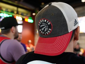 Basketball fans watch game three of the NBA championship between the Toronto Raptors and the Golden State Warriors at 1st RND sports bar in Edmonton on Wednesday June 5, 2019.