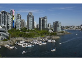 Condo towers line the north shore of False Creek in Vancouver.