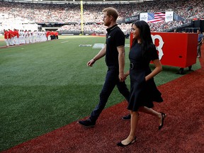 Prince Harry, Duke of Sussex, and Meghan, Duchess of Sussex, arrive on the field prior to the start of the first of a two-game series between the New York Yankees and the Boston Red Sox at London Stadium in Queen Elizabeth Olympic Park on June 29, 2019. (PETER NICHOLLS/AFP/Getty Images)