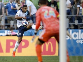Jun 29, 2019; Seattle, WA, USA; Vancouver Whitecaps defender Ali Adnan (53) crosses the ball against the Seattle Sounders during the first half at CenturyLink Field. Mandatory Credit: Jennifer Buchanan-USA TODAY Sports