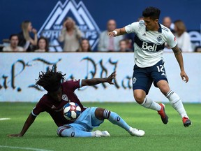 Colorado Rapids defender Lalas Abubakar battles for the ball against Vancouver Whitecaps forward Fredy Montero during a 2019 game at B.C. Place. Abubakar's own goal gifted Minnesota a 2-1 win Wednesday, injecting life into the Whitecaps' 2020 playoff quest.