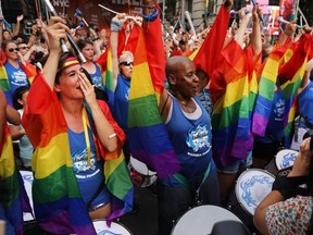 Drummers join revelers as they gather in front of the Stonewall Inn to listen to speakers and performers at an evening rally as New York City celebrates Pride Month on June 28, 2019.