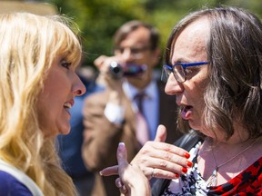 PPC candidate Laura Lynn Tyler Thompson (left) and human rights activist Morgane Oger (right) argue at an anti-SOGI rally held at the Vancouver Art Gallery.