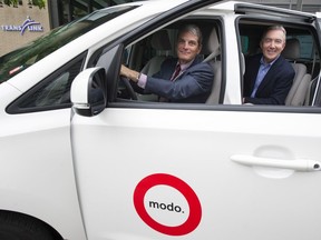 TransLink CEO Kevin Desmond (left) and Patrick Nangle, CEO of Modo, in a Modo van like those used in the transit authority's vanpool pilot project.