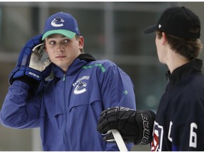 Jake Virtanen of the Vancouver Canucks, left, was once described as the same type of player Micheal Ferland is being compared to now.
