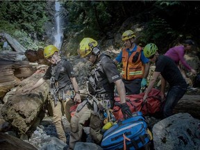 Eight calls were received by three different search and rescue crews across the Greater Vancouver area over the course of the weekend, including North Shore Rescue (pictured) who rescued a male hiker who had slid on a snowy slope and suffered a head injury and broken wrist on Sunday.