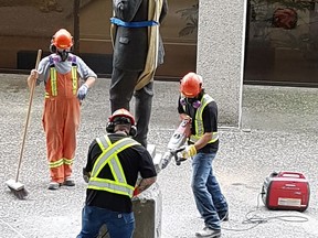 The controversial statue of Judge Begbie outside the Law Courts in New Westminster was removed Saturday, July 7. Picture credit: Matt Flemming, special to Postmedia News. [PNG Merlin Archive]