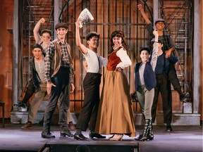Daniel Curalli stars as “Davey Jacobs,” Caleb Lagayan as “Race,” Julia Ullrich as “Katherine Plumber,” and Jordyn Bennett as “Les Jacobs” in the Theatre Under the Stars production of Newsies, playing until Aug. 17 at the Malkin Bowl. Photo: Lindsay Elliott