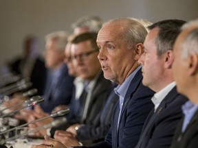 B.C. Premier John Horgan responds to a question at the Council of the Federation meeting in Saskatoon on Thursday, July 11. He is marking two years in power under a co-operation agreement with the B.C. Green party.