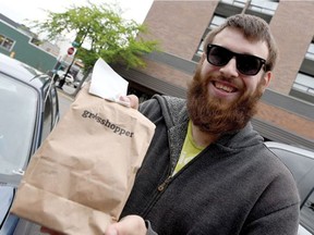 Graham Ash holds his purchase from Grasshopper Retail Inc. Grasshopper Retail is Prince George's first legal cannabis store. It opened Thursday, July 11.