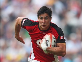 Sean Duke of Canada makes a break during the qualifier final between Spain and Canada at the 2012 IRB Hong Kong Sevens at Hong Kong Stadium on March 25 in So Kon Po.