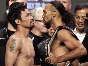 Boxers Manny Pacquiao from the Philippines and Keith Thurman from the U.S. face off during their weigh-in on July 19, 2019, at the MGM Grand Hotel. The fighters will meet on July 20th in a WBA super world welterweight title fight