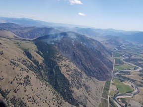 A wildfire burns near Cawston, B.C. in this undated handout photo. Wildfire crews in British Columbia hope to get the upper hand on a stubborn blaze that broke out last week in the southern Okanagan and has scorched just over four square kilometres of timber and bush, but is now considered a smouldering ground fire.