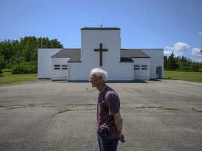 Rod Farrell, a warden at the Church of St. Barra, poses in front of the church closed by the Diocese of Antigonish in Christmas Island, Cape Breton, N.S. on Friday, July 26, 2019. Farrell is part of a renegade group of Roman Catholics defying a bid by the local bishop to shut down their 200-year-old parish following years of declining population and the fallout from a sexual abuse scandal that resulted in a $16-million settlement for 125 confirmed and alleged victims.