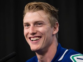 Vancouver Canucks defenceman Tyler Myers laughs during a news conference after signing a five-year contract with the NHL hockey team, in Vancouver, on Monday July 1, 2019. Photo: Darryl Dyck, The Canadian Press