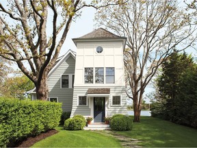 Lower siding in Benjamin Moore's Moonshine 2140-69 and upper siding in Benjamin Moore's White Opulence OC-69, from their Aura Exterior paint collection.