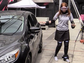Ford Canada and Éduc'alcool teamed up to demonstrate the dangers of impaired driving in Montreal, on Wednesday, June 17, 2015. Student Gabrielle Lauzier staggers about in the simulator suit that allows a sober person to experience to effects of drunkenness.