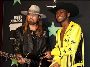 Billy Ray Cyrus, right, and Lil Nas X pose backstage at the 2019 BET Awards in June.