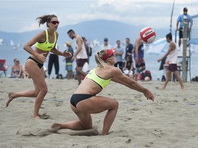 Players compete in the annual Vancouver Open beach volleyball tournament at Kits Beach in Vancouver Sturday.