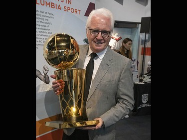 Toronto Raptors assistant coach and member of the B.C. Sports Hall of Fame Alex McKechnie holds the Larry O'Brien NBA Championship Trophy while he makes an appearance at the sports hall on Tuesday, July 23.