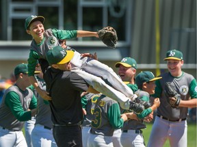 Coquitlam's Brady Dorwart is hoisted up in celebration of their win over Little Mountain in the final game of the B.C. Little League Championships at Hillcrest Park in Vancouver on Sunday. Photo: Arlen Redekop/Postmedia