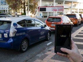 An Uber app in downtown Vancouver: The ride-hailing service is preparing to enter the B.C. market when it gets the green light this fall.