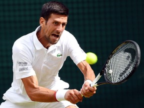 Serbia's Novak Djokovic in action during his men's semifinal match against Spain's Roberto Bautista Agut at the Wimbledon tennis championships in London on July 12, 2019.