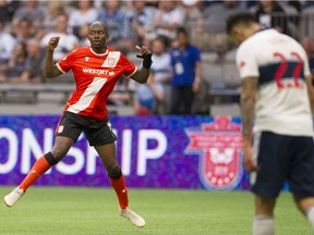 Cavalry FC #9 Jordan Brown celebrates his goal in front of Vancouver Whitecaps FC Erik Godoy in a Canadian Championship soccer game at BC Place, Vancouver, July 24 2019.