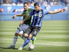 Portland Timbers Sebastian Blanco, left, "pats" Blerim Dzemaili of the Montreal Impact on the back of the neck during MLS action in Montreal. Blanco will be one of the Timbers to watch when the Whitecaps play in Portland Saturday night.