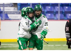Victoria Shamrocks' Brian Robb (24) and Caleb Kueber (25) celebrate a goal during the team's thrilling 12-8 overtime win against the Okotoks Raiders on Monday. The win moved the Shamrocks into the Minto Cup finals against the Orangeville Northmen. Photo: Courtesy of BCAJLL.
